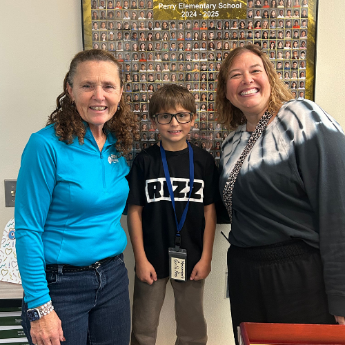 Jayme Ortiz, Perry's Stairclimber for October, poses with his staff.